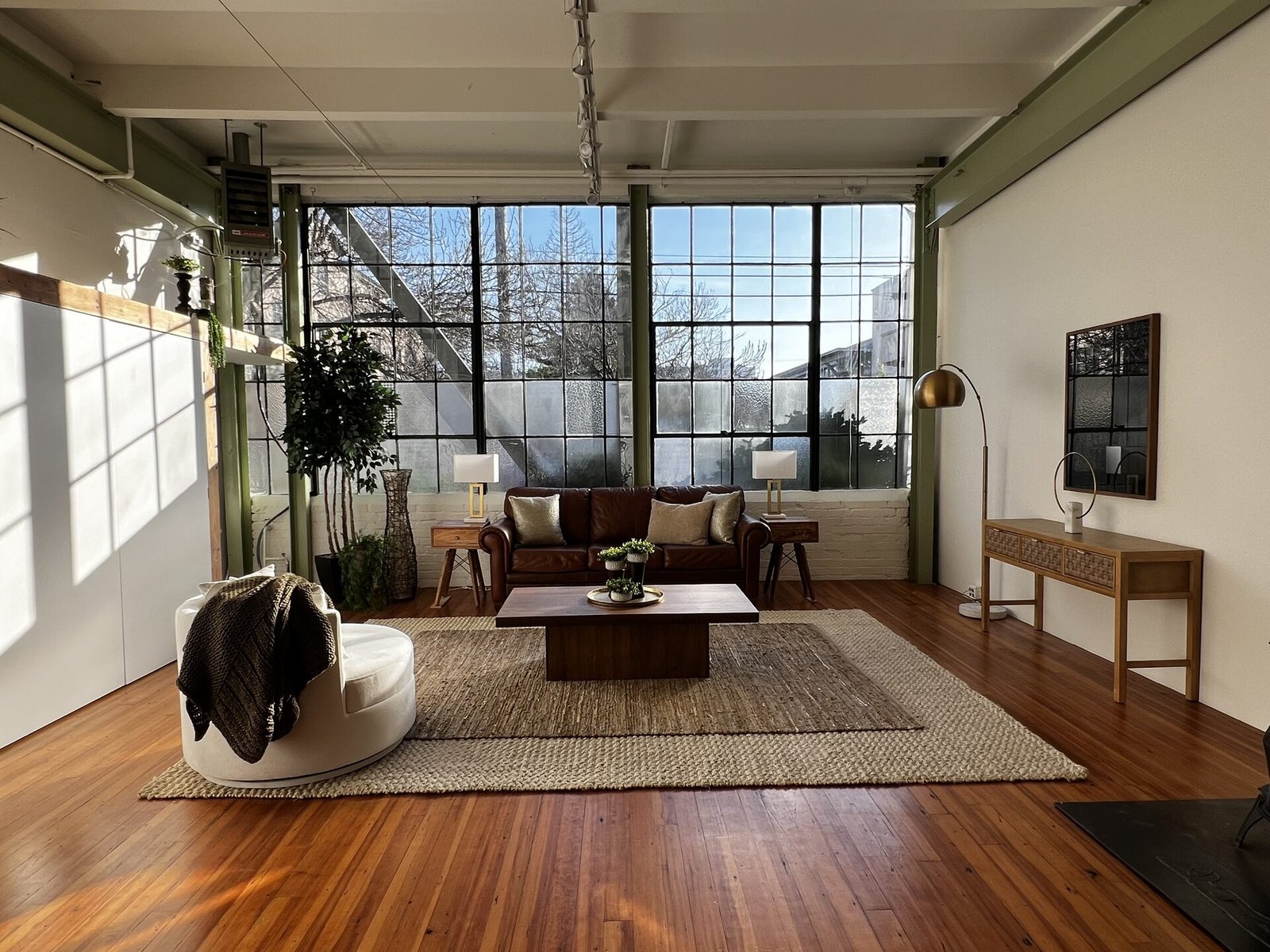 Sleek living room with neutral tones and modern furniture.